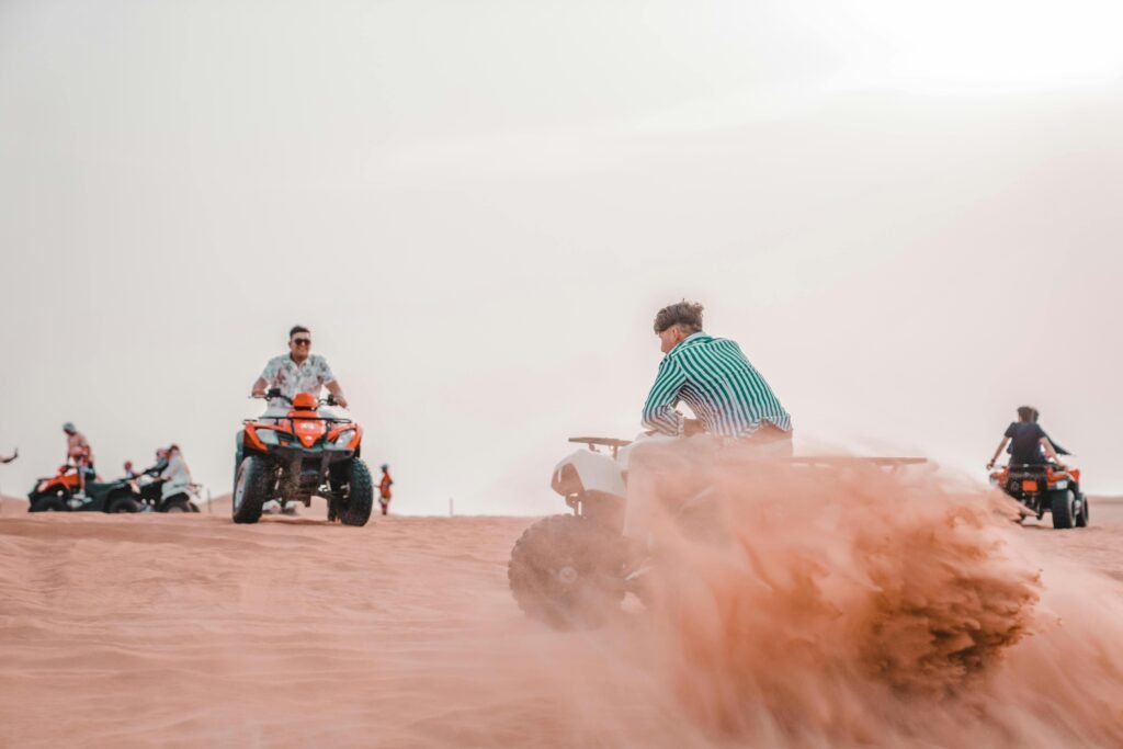 zipwp-image-26568792 Experience the excitement of quad biking across sandy desert dunes in a thrilling outdoor adventure.